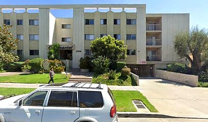 Street-facing exterior of 1535 N Hobart Blvd; photo enhanced for presentation