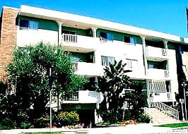 Street-facing exterior of 400 S Berendo St; photo enhanced for presentation