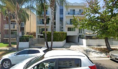 Street-facing exterior of 427 S Manhattan Pl; photo enhanced for presentation