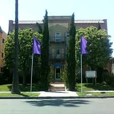 Street-facing exterior of 539 S Manhattan Pl; photo enhanced for presentation