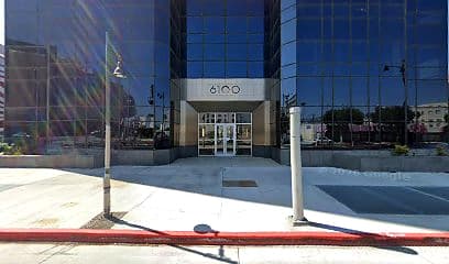 Street-facing exterior of 6100 Wilshire Blvd; photo enhanced for presentation