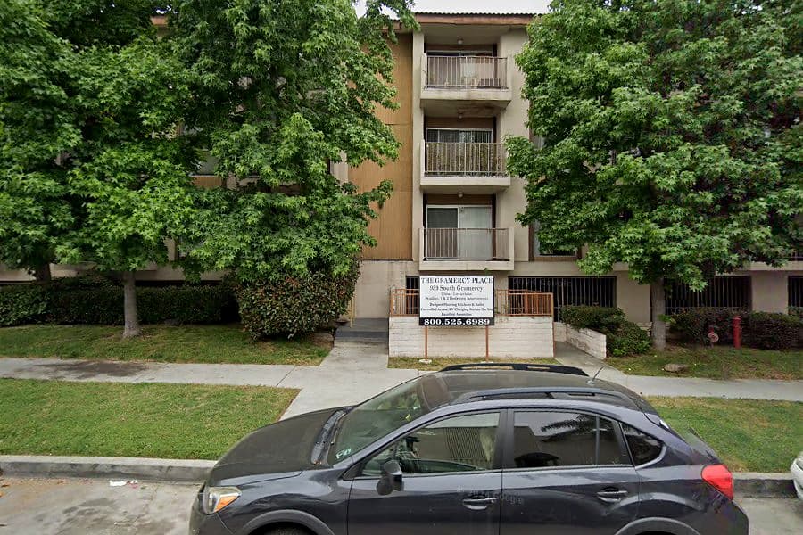 Street-facing exterior of 959 S Gramercy Pl; photo enhanced for presentation