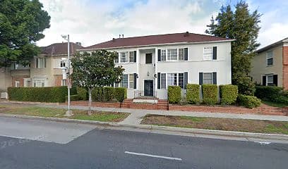Street-facing exterior of 9649 W Olympic Blvd; photo enhanced for presentation